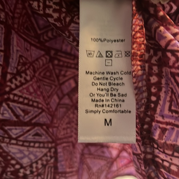 Medium LulaRoe geometry high low print. Never been worn! - Picture 2 of 4